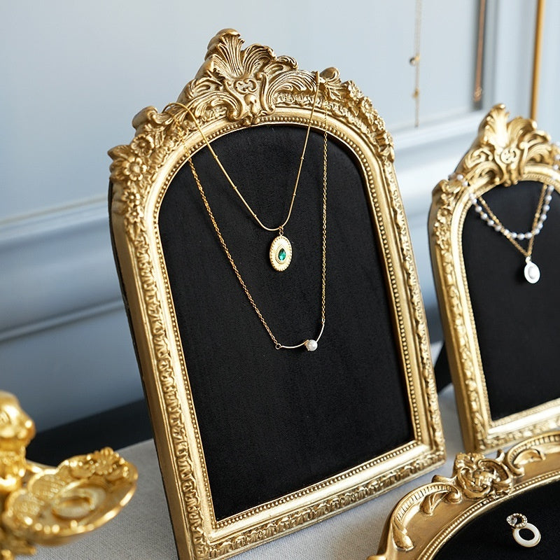 Black velvet necklace frames with gold-tone baroque trim