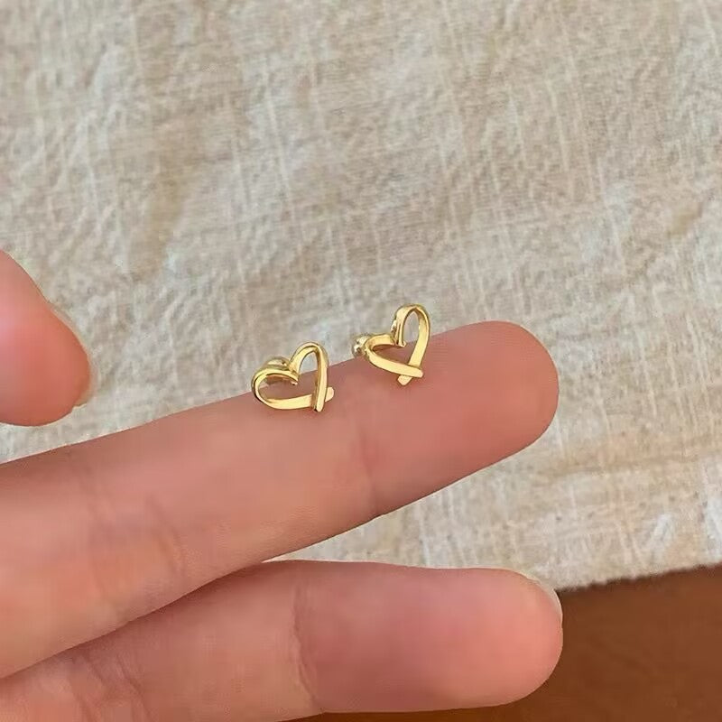 Dainty gold-tone open heart stud earrings