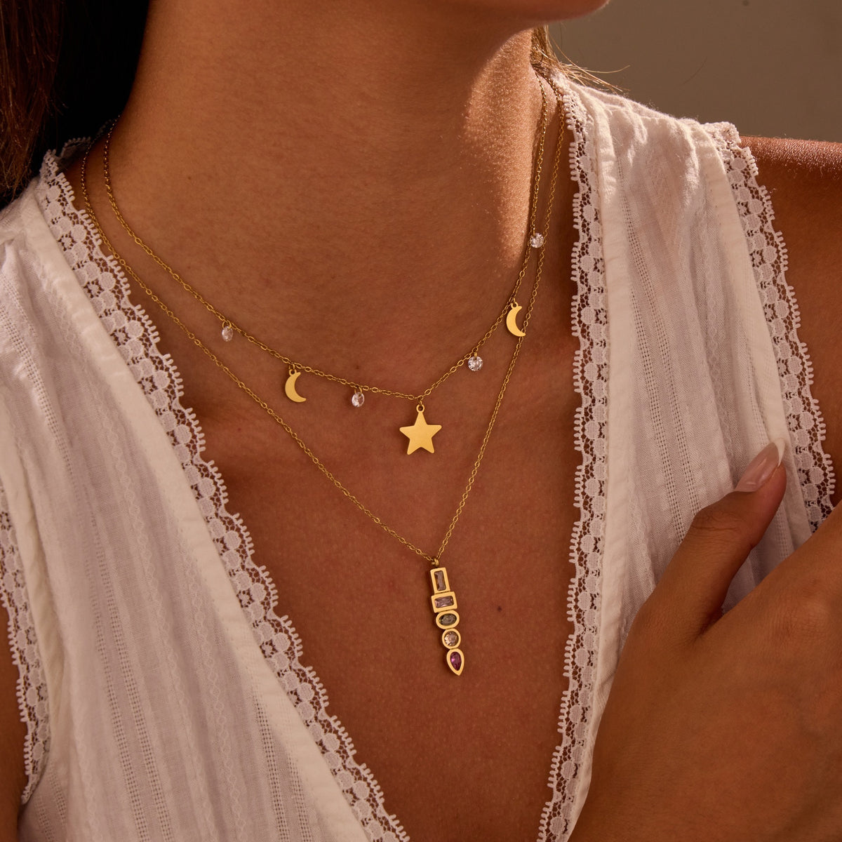 Gold-tone star and moon charm necklace