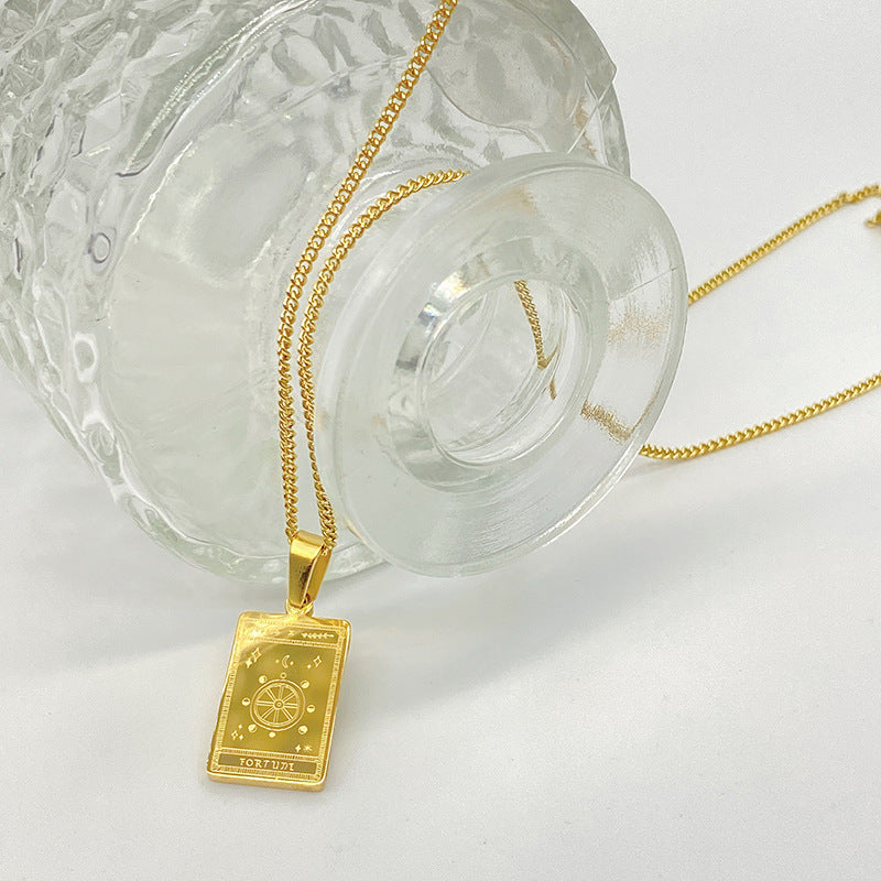 Gold-tone engraved tarot card pendant necklace