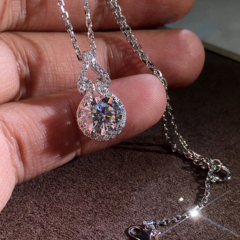 Sparkling round halo pendant necklace on a silver-tone chain