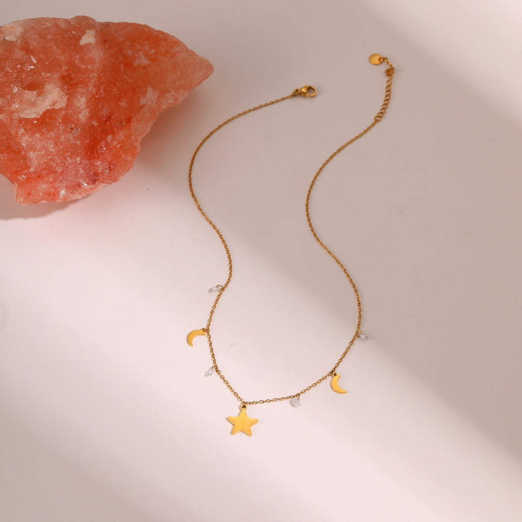 Gold-tone star and moon charm necklace – photo 2