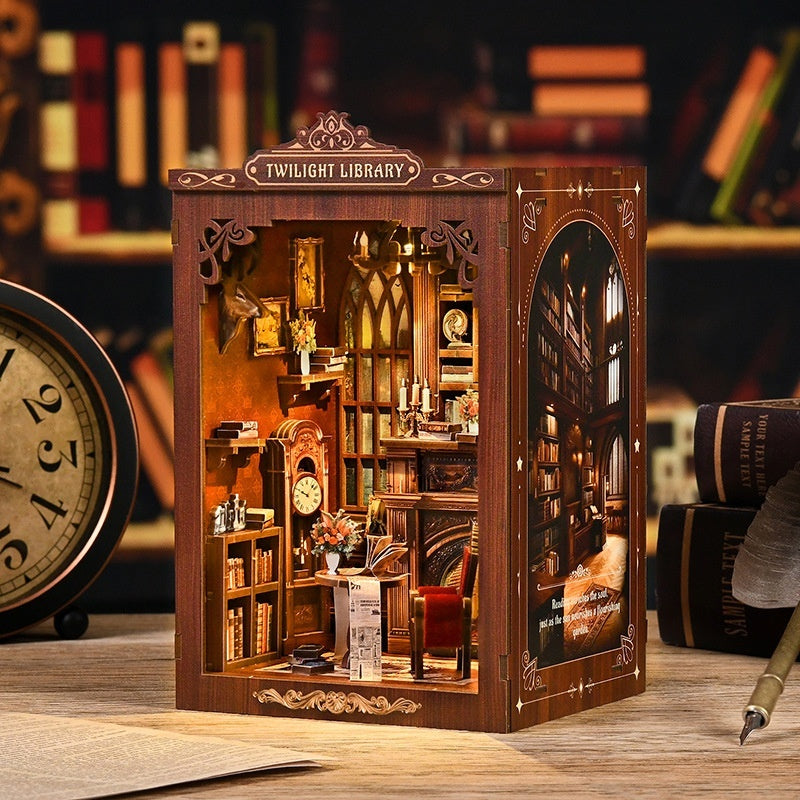 Twilight Library book nook kit lit up on a bookshelf
