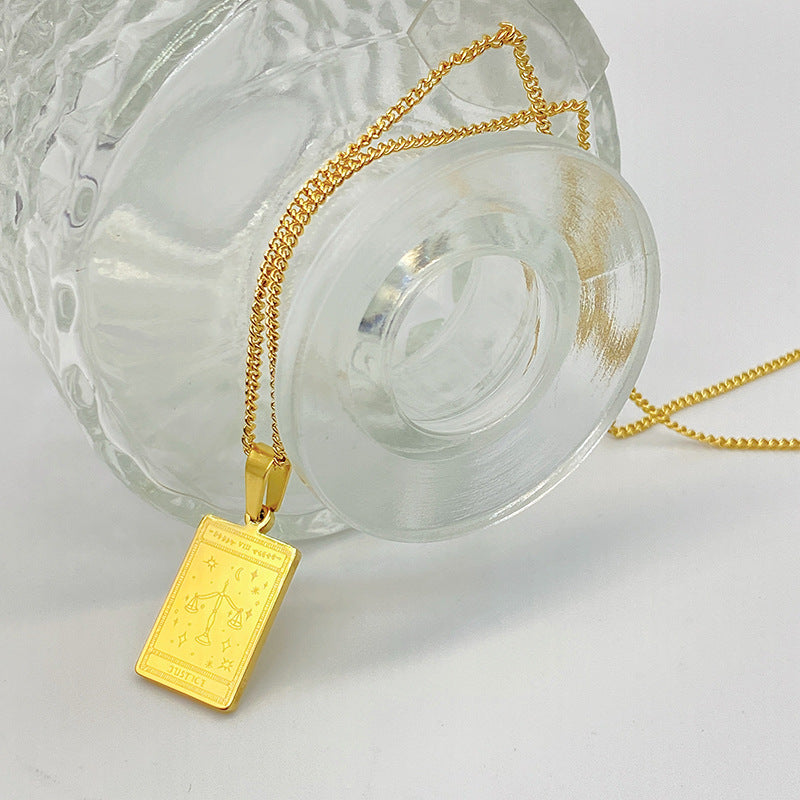 Gold-tone engraved tarot card pendant necklace – photo 2