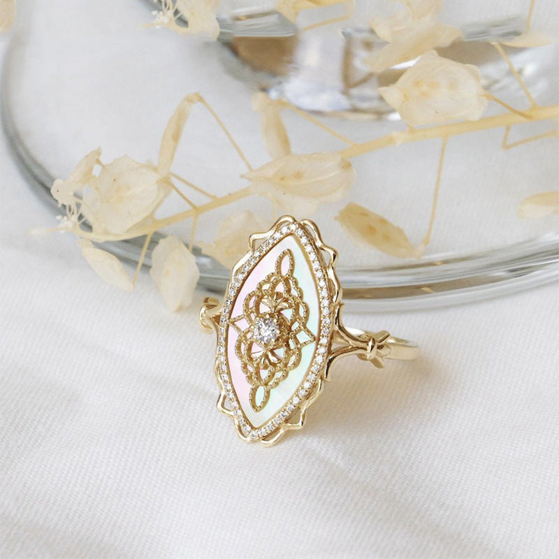 Gold-tone marquise ring with shell-look inlay