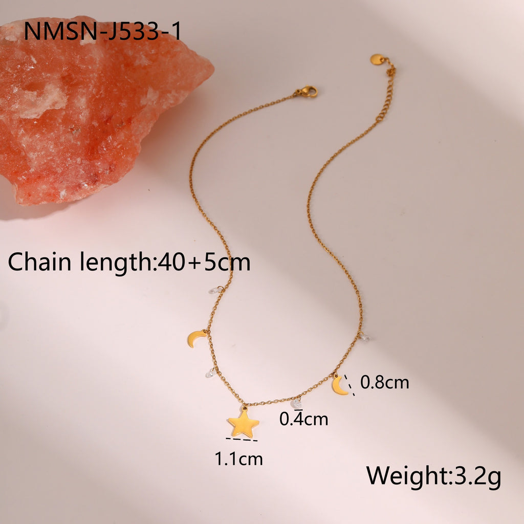 Gold-tone star and moon charm necklace – photo 5