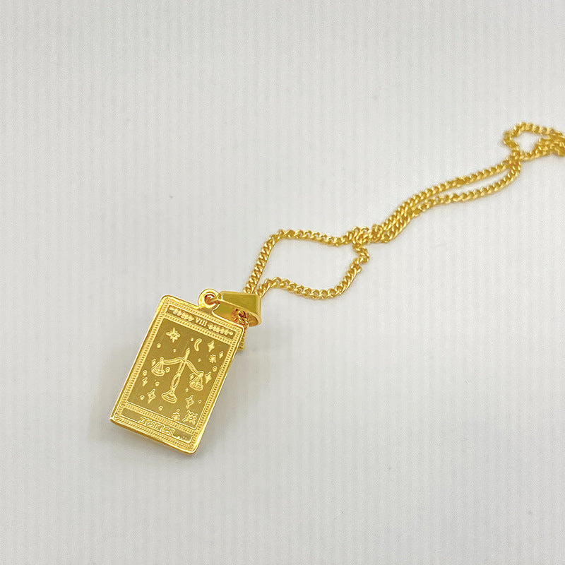 Gold-tone engraved tarot card pendant necklace – photo 12
