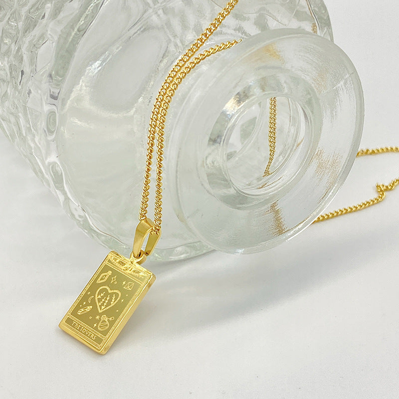 Gold-tone engraved tarot card pendant necklace – photo 21