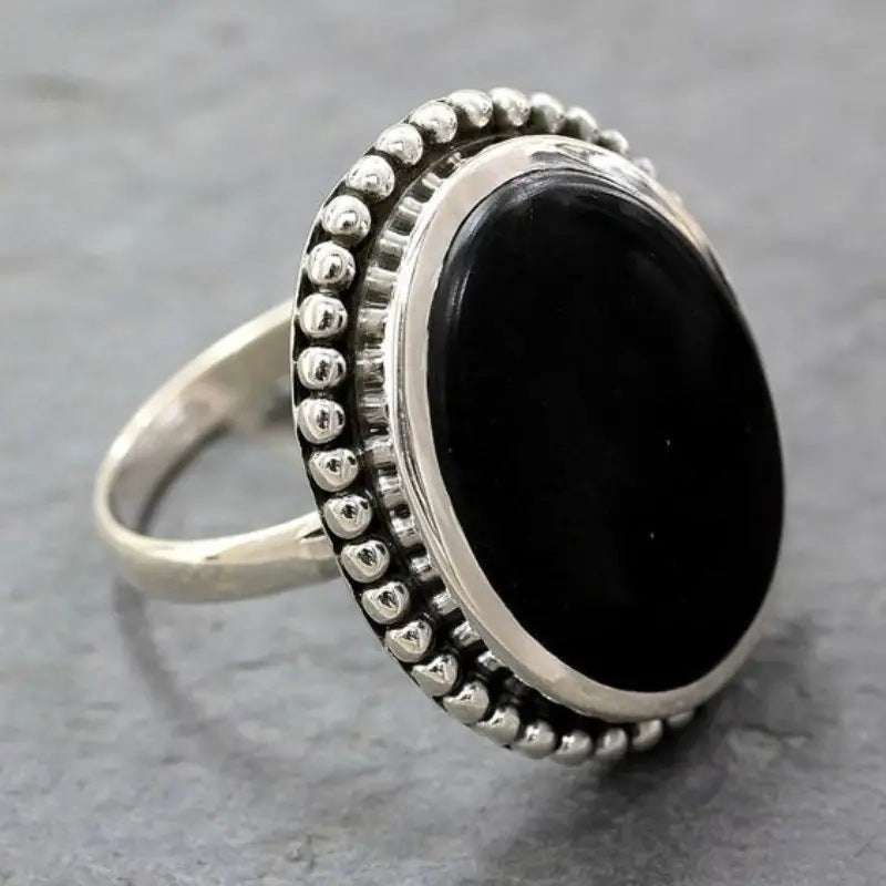 Vintage silver-tone oval statement ring with black stone